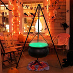 Glowing green tripod cauldron on a festive porch