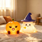 The ghost and pumpkin pair side by side