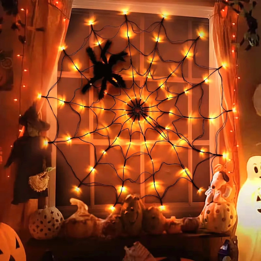 Orange spider web lights in a window