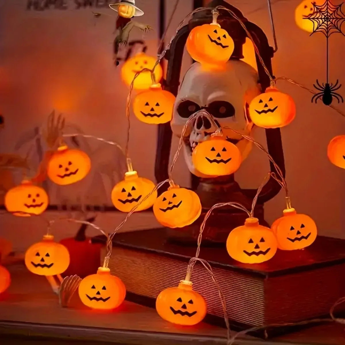 Pumpkin string lights on a spooky shelf