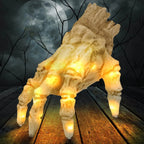 Glowing skeleton hand crawling across a wooden floor