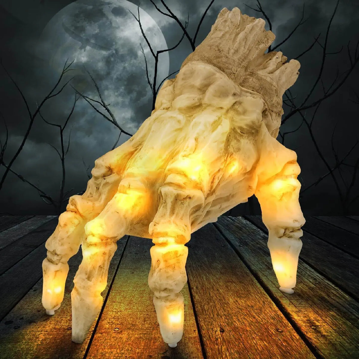 Glowing skeleton hand crawling across a wooden floor