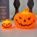 Small and large pumpkin lights side by side