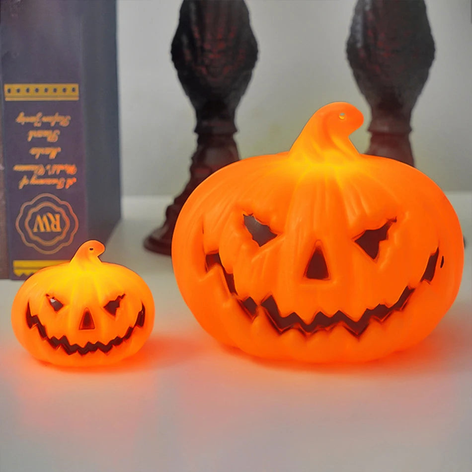 Small and large pumpkin lights side by side