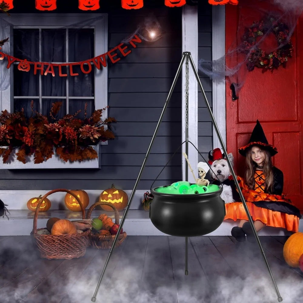 Cauldron at a front door with pumpkins