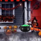 Cauldron at a front door with pumpkins